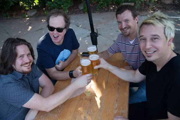Knocking back a pint at Olde Mecklenburg Brewery with Temperance League: (from left) Eric Scott, Shawn Lynch, CL music editor Jeff Hahne and Bruce Hazel - SHANE CUDAHY