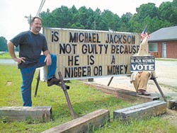 JOHN SUGG - Patrick Lanzo has an eye-catching sign in front of his Georgia Peach bar