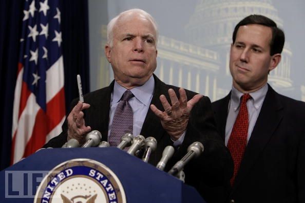 "Pay no attention to the imbecile behind me." &#151; John McCain and Frothy Santorum in better times