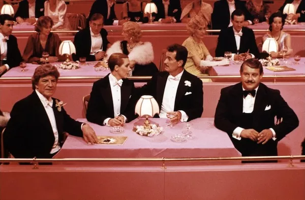 PRETTY IN PINK: Robert Preston, Julie Andrews, James Garner and Alex Karras in Victor/Victoria (Photo: Warner)