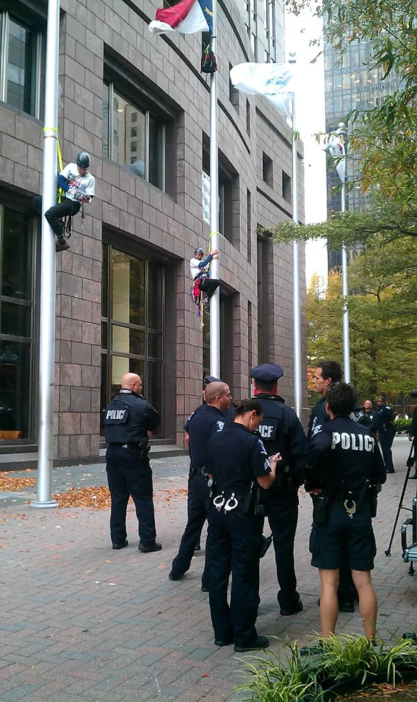 Protesters on flag poles