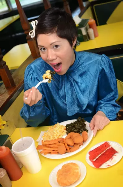 Sharon Suy samples some of the magic at Angie's Diner: fried squash, sweet potato fries, mac 'n' cheese, collard greens, a biscuit, and, of course, a slice of the lovely red velvet cake. - GRAHAM MORRISON