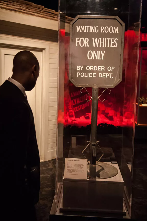 Signs like this one divided the races across the South. There were "white" and "colored" waiting rooms, hospital wards, schools and cemeteries. - JOE MARTIN