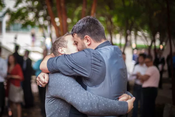 Smooches! Jason Roberts and Aaron Merckle hug it out. - BRHEA KONEMAN