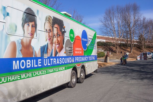The modified RV parked in front of the LaTrobe Drive women's clinic, offering ultrasounds and counseling to woman considering an abortion - GRANT BALDWIN