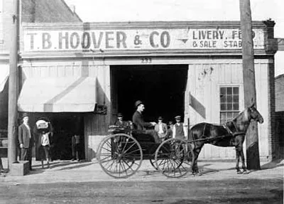 Thomas B. Hoover in the early 1900s on a carriage outside his livery stable at 21 North College Street.