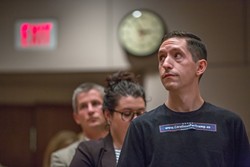 A line of speakers wait their turn to address council. (Photo by Grant Baldwin)