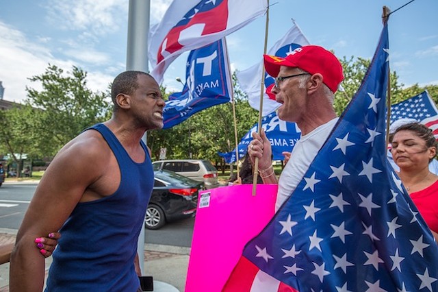 A man confronts Trump supporters in front of the Government Center. (photo by Grant Baldwin)