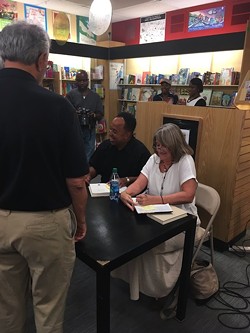 Belton Platt (sitting, left) with Pam Kelley at a recent signing at Park Road Books. (Photo by Betsy Thorpe)