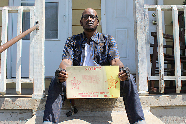 Alvin C. Jacobs Jr. outside of a home in Brookhill, where he shot his most recent exhibit. (Photo by Ryan Pitkin)