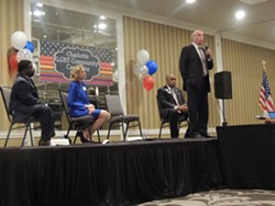 Mayor Dan Clodfelter, pictured with other Democratic mayoral candidates, addresses the crowd at the LGBT Community Candidate Forum in early August. - PHOTO BY RYAN PITKIN