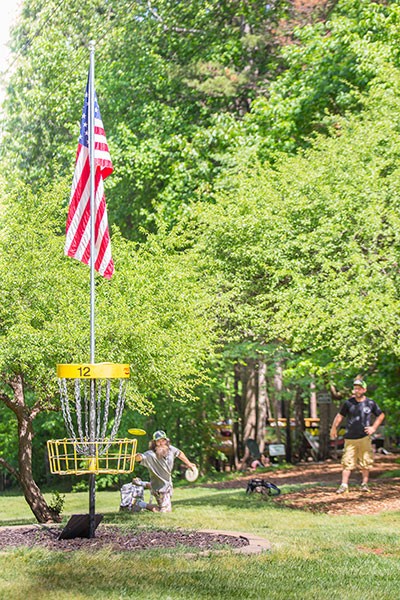 Players approach Hole 12 at Brackett’s Bluff during a recent fundraiser tournament for the family of a regular at Brackett’s who had passed away. (Photo by Brian Twitty)