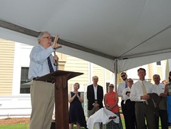 Dale Mullinnex addresses a crowd of Housing First Charlotte-Mecklenburg supporters at a recent celebration and tour of the expansion. - RYAN PITKIN