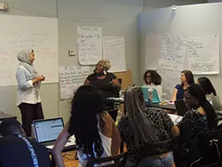 Na'ilah El-Amin listens to feedback during a canvassing workshop. (Photo by Ryan Pitkin)
