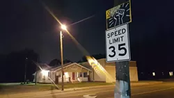 Signs that once read “We Buy Homes” have been repurposed and placed back on the streets to support the fight against gentrification happening in west Charlotte. - DANIELLE HILTON