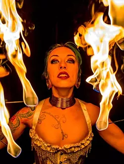 Collette Ellis plays with fire. - ANDREW DOLAN