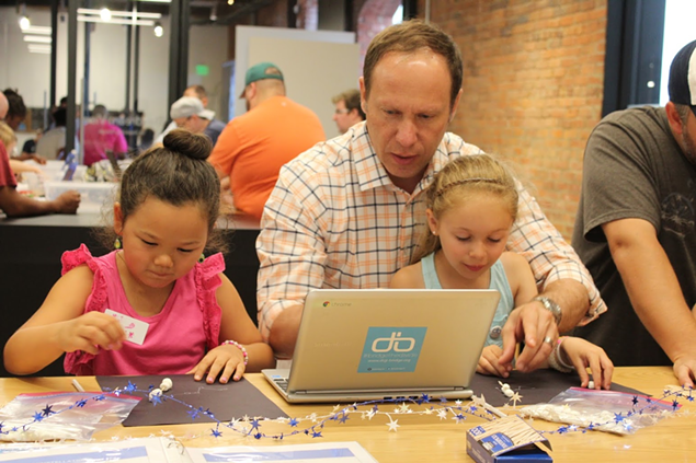 Families gathered at Google Fiber recently for Digi-Bridge's "Daddy Daughter Code-In" event.