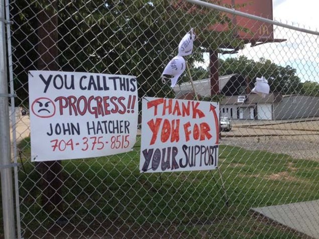 Photo of signs protesting gentrification by Kennieth Holmes.