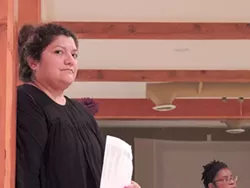 At a recent Educate to Engage meeting, amalia deloney looks on during a group exercise. (Photo by Ryan Pitkin)