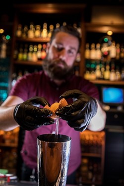 Kel Minton has a cocktail inspired by his grandfather's penchant for cigarettes and scotch. (Photo by Peter Taylor)
