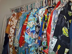 Beeler's closet full of TSC uniforms: dozens of gaudy Hawaiian shirts.