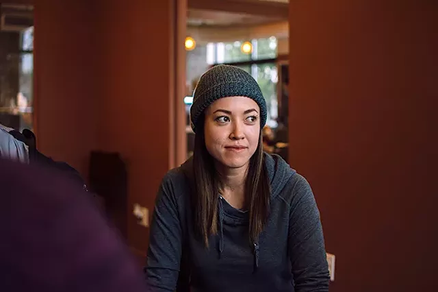 Cristina Veale listens on at a recent “Coffee & Coding” event. (Photo by Brittani Burns)