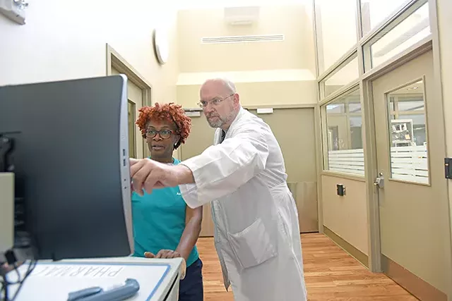 A psychiatrist speaks with a psychiatric nurse in the Atrium Behavioral Health Charlotte emergency department. (Photo courtesy of Atrium Health)