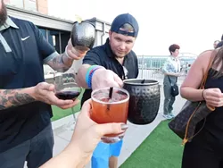 Aaron Stamey leads a toast.
