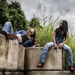 Rich Basco (left) and Adrienne Nixon Basco get lost in the weeds. (Photo by Cody Bennett)