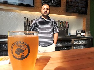 Ketan Patel at Pop the Top Craft Beer Shop. (Photo by Ryan Pitkin)