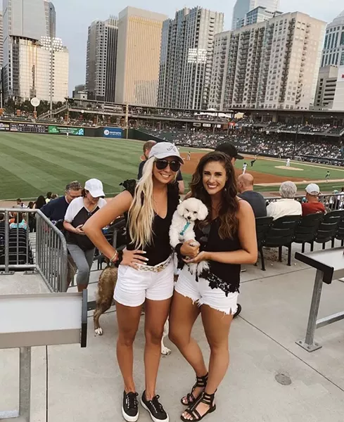 (L-R) Mia Chamberlain & Kaitlin Phelps enjoy Bark at the Ballpark with Beau