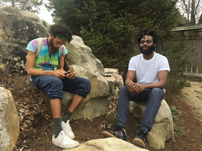 Oba Amitabha (left), promotor with Charlotte creatives Funk-Shun, and Black Linen kick back at the Botanical Gardens - PHOTO BY MARK KEMP