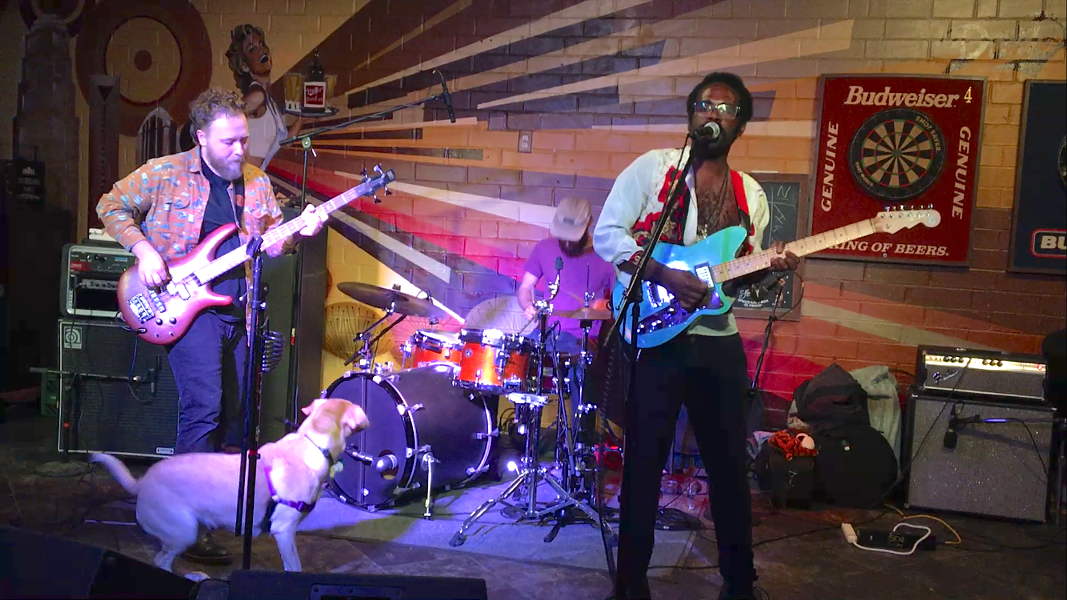 A potential new member looks on (at bottom left) as the current three-piece (Morrill, Pugliese and Robinson) performs at Hattie's on May 5. - PHOTO BY MARK KEMP