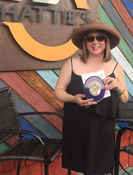 Shalini shows off a cool, purple-vinyl copy of her 1992 Vinyl Devotion EP.
