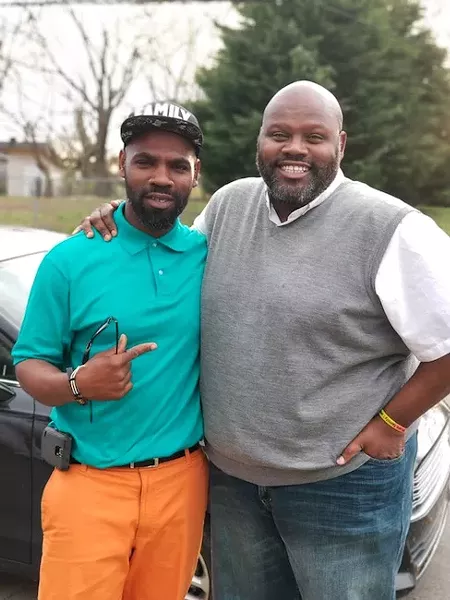 Ray with his brother, Aron McKinnon.