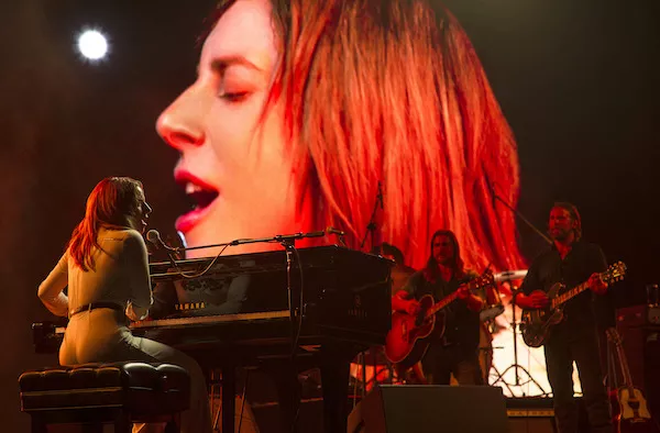 Lady Gaga and Bradley Cooper (far right) in A Star Is Born (Photo: Warner)