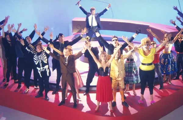 David Bowie (background) and Patsy Kensit (front center) in Absolute Beginners (Photo: Twilight Time)