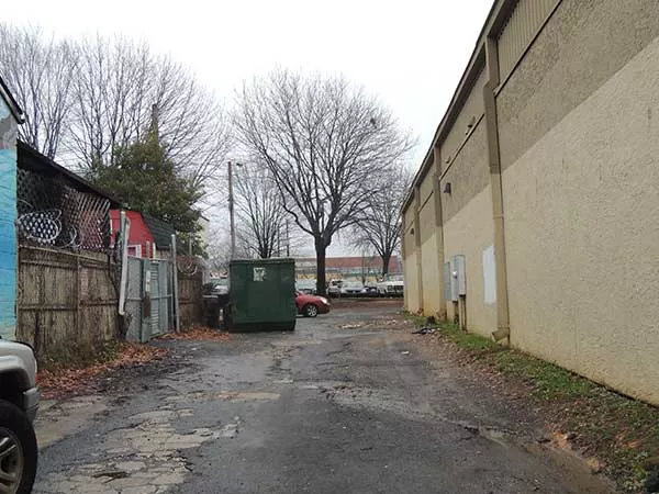 An alleyway next to Snug Harbor is oft-used as a shortcut during late-night hours. Some neighbors would like to see more lighting in spots like this. - RYAN PITKIN