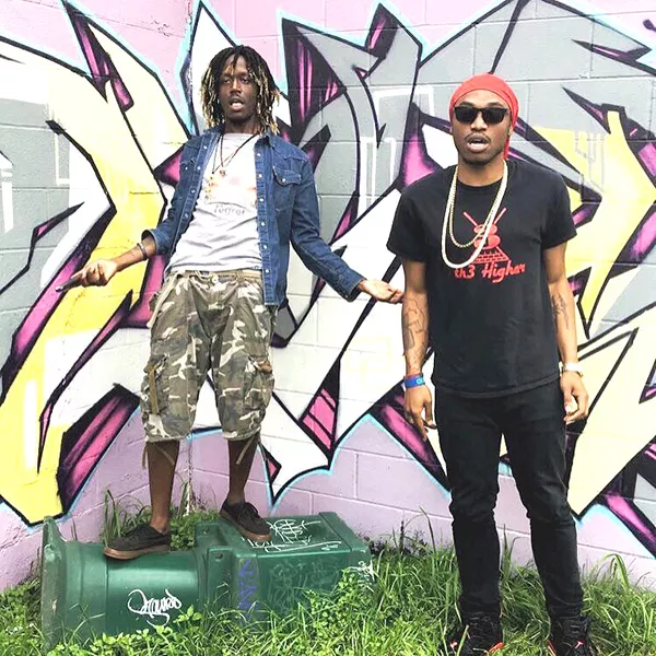 Tizzy (left) and Kizzy hang out in front of some Austin mural art during South By Southwest 2017. (Photo by Ayopenz)