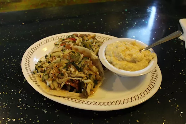 A Krazy Fish favorite: salmon tacos with jalapeno cheddar grits.