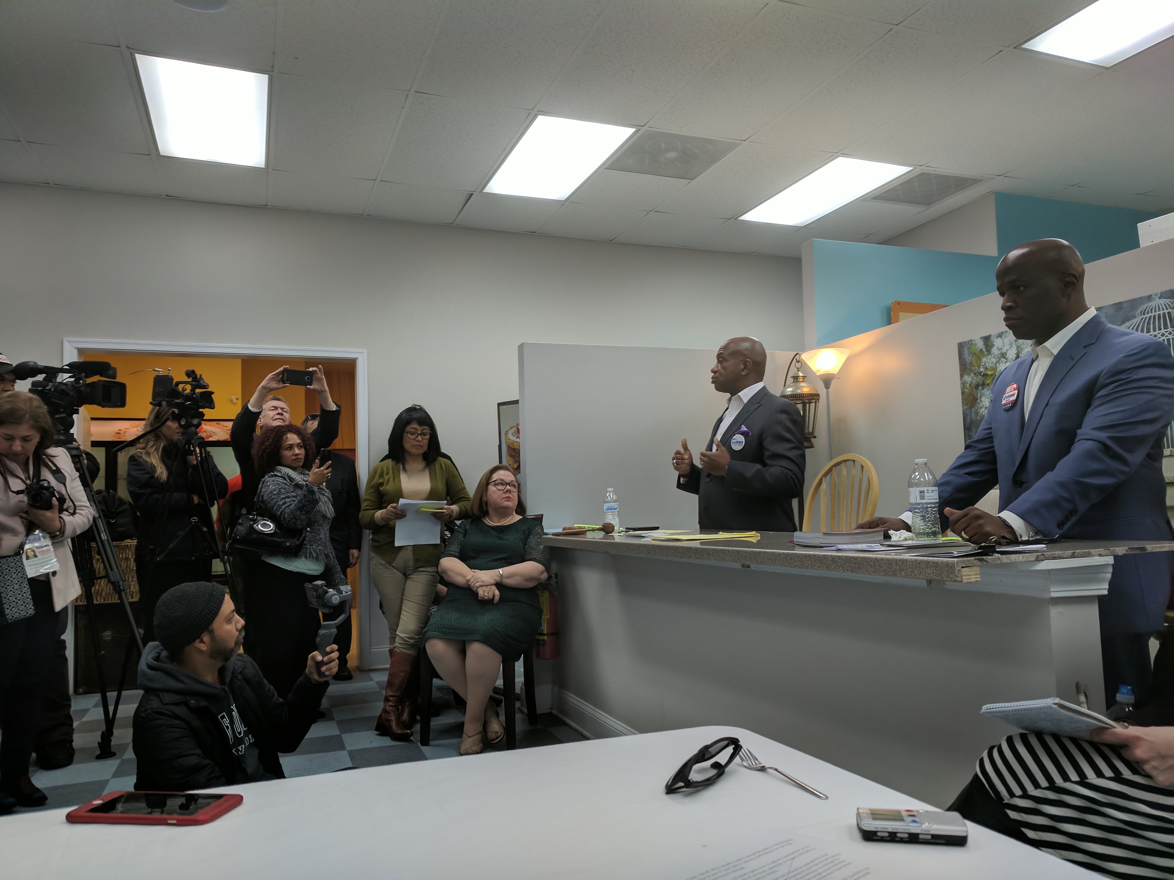 Candidates Gary McFadden [left] and Antoine Ensley at a recent debate in Las Delicias Bakery in east Charlotte. (Photos by Ryan Pitkin)
