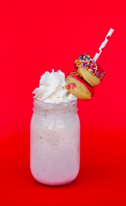 Honeysuckle Gelato’s ultra-‘grammable "Over the Top Strawberry Shortcake Shake for Two” with two mini glazed doughnuts by Suárez Bakery. $6.50 per shake. - Uploaded by greenolivemedia