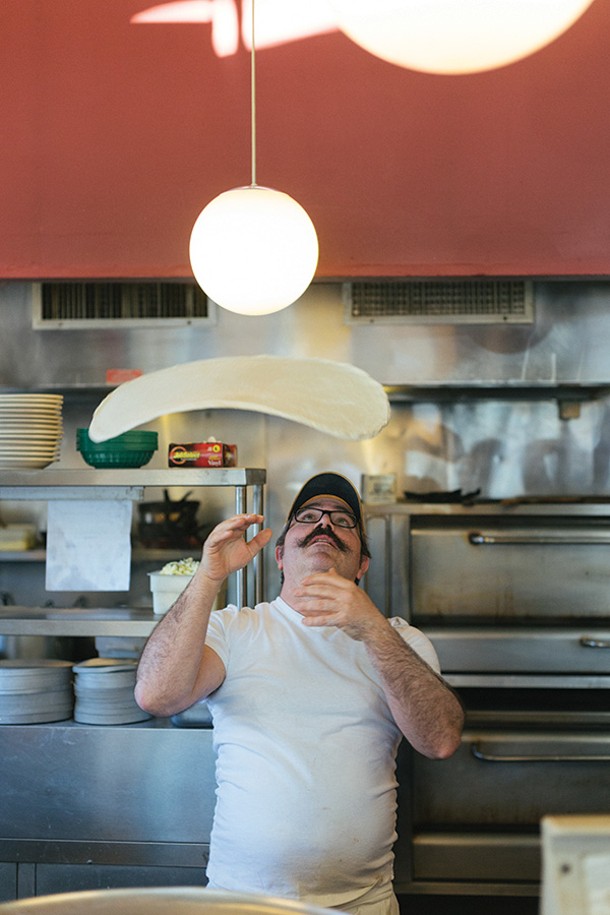 Bryan Roeff throws a pizza dough into the air at Catskill Mountain Pizza Co. in Woodstock. - TOM SMITH