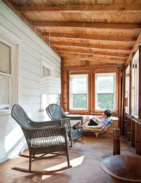 Carroll relaxing with Jack on the porch in a bathtub couch designed by her daughter, Mehla Goodrich. - DEBORAH DEGRAFFENREID