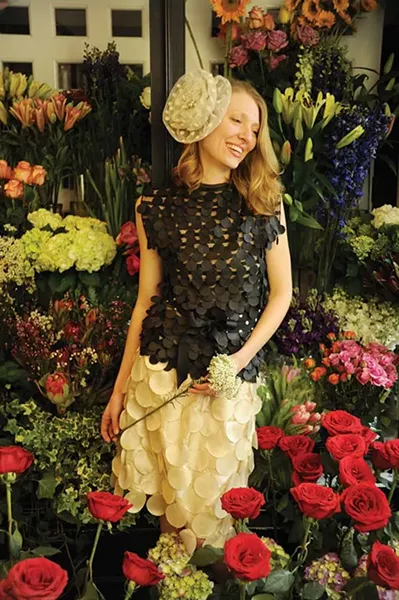 Cassandra Hansen-Patsch wearing a black laser-cut petal top, cream laser-cut petal skirt, black-and-white cotton polka dot bow tie belt, and vintage tulle polka dot bridal fascinator, all Handmade and One of a Kind by Juda Leah in Saugerties,