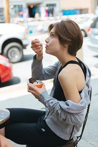 Emma Huibregtse enjoys a cup of ice cream in downtown New Paltz after skydiving in Gardiner. - THOMAS SMITH