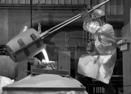 Foundry supervisor Eddie Sanchez pours bronze into a silicon shell for a sculpture in progress. - HILLARY HARVEY