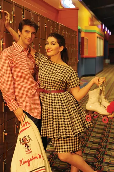 Giddy in Gingham: Samuela Rae wearing handmade gingham dress and red belt. Evan Clayton wearing workwear denim pants, red gingham buttercup shirt, and Kingston drum and bugle corps jacket. Makeup by Samuela Rae. From outdated café. - KELLY MERCHANT
