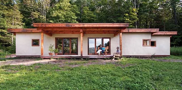 Keiko Knowles with her son, Takemi, and husband, Martin, on her mother’s front porch.
