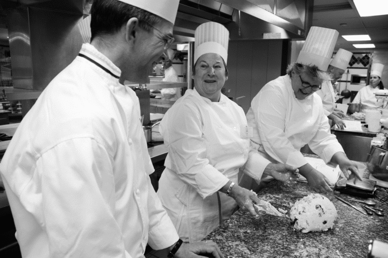 Lecturing Instructor Stephen Eglinski (left) consults over an orange and cranberry scone dough prepared by Culinary Institute of America Boot Camp students Linda Jochem and Pam Burt. - JENNIFER MAY